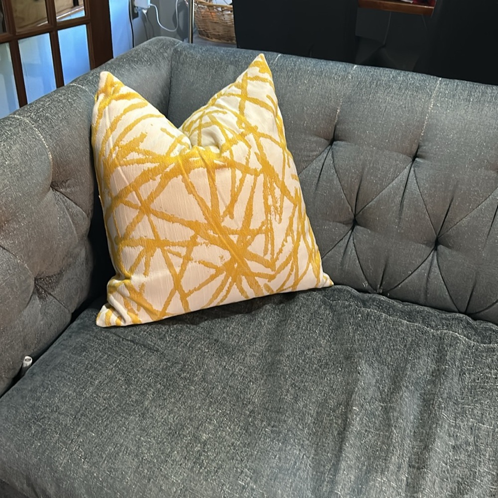 Cream and yellow throw pillow